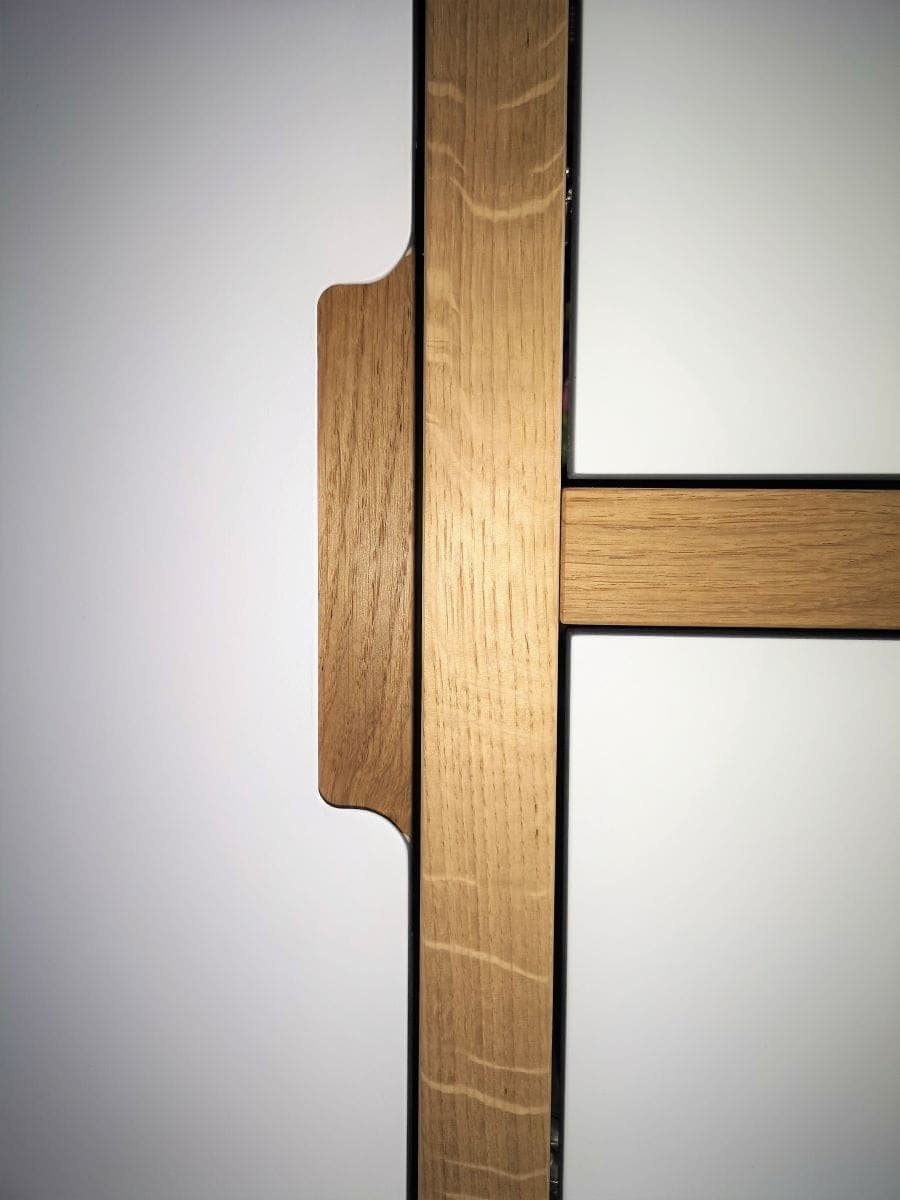 Cutout handle detail on Oak framed wardrobe