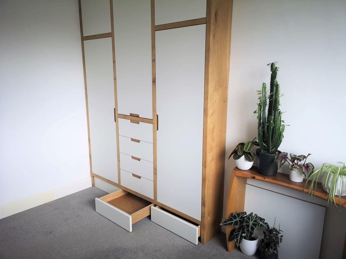 plinth drawers hidden storage for Oak framed wardrobe with oak plywood drawers