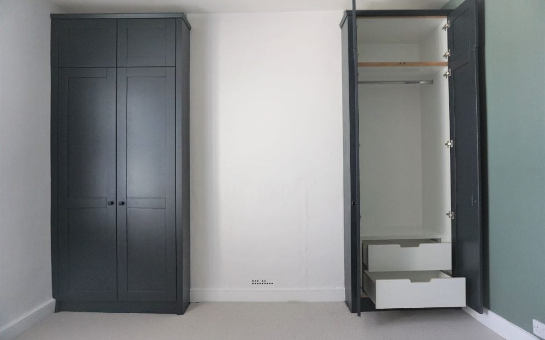 Black fitted wardrobes with white interior