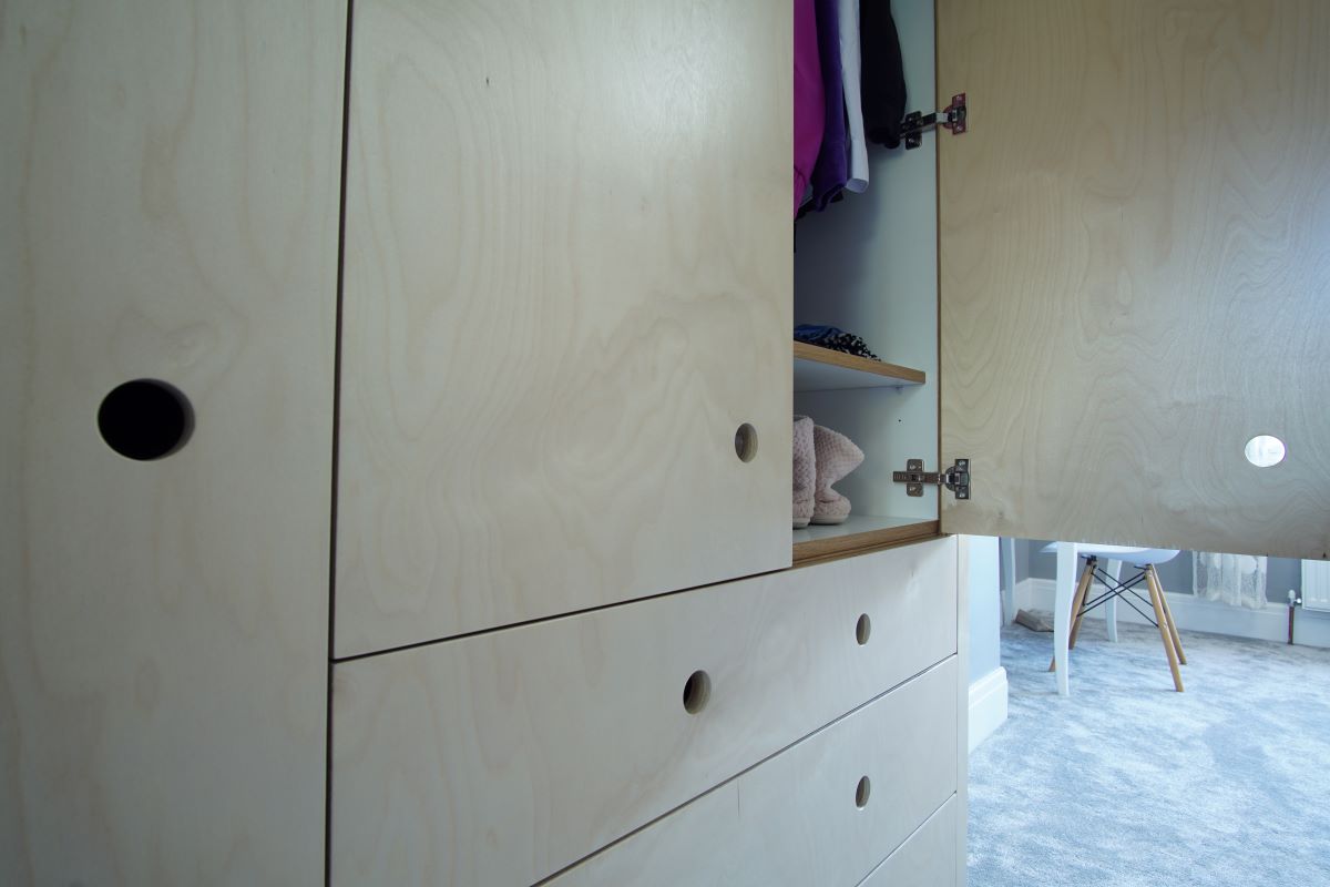 interior of a childs birch plywood wardrobe
