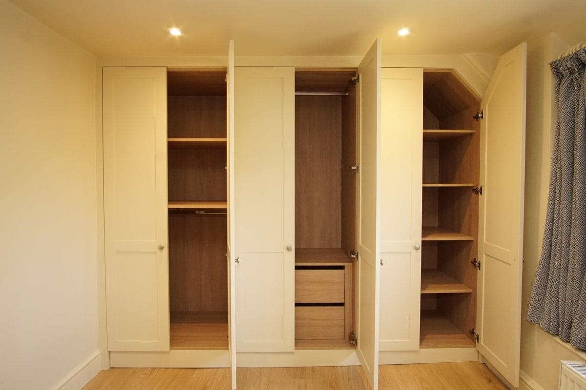 Bedroom fitted furniture bespoke wardrobe with oak interior and drawers