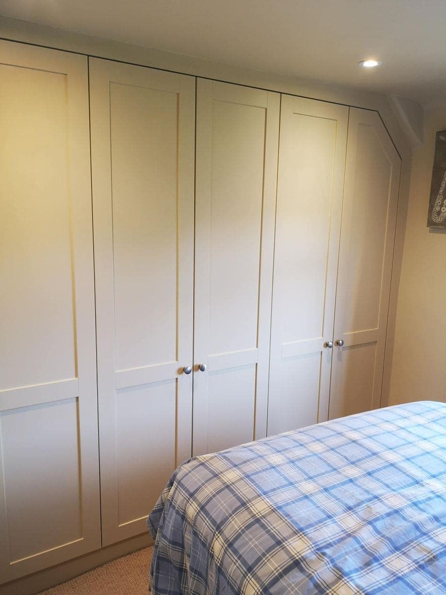 a closet with a bed and a bed