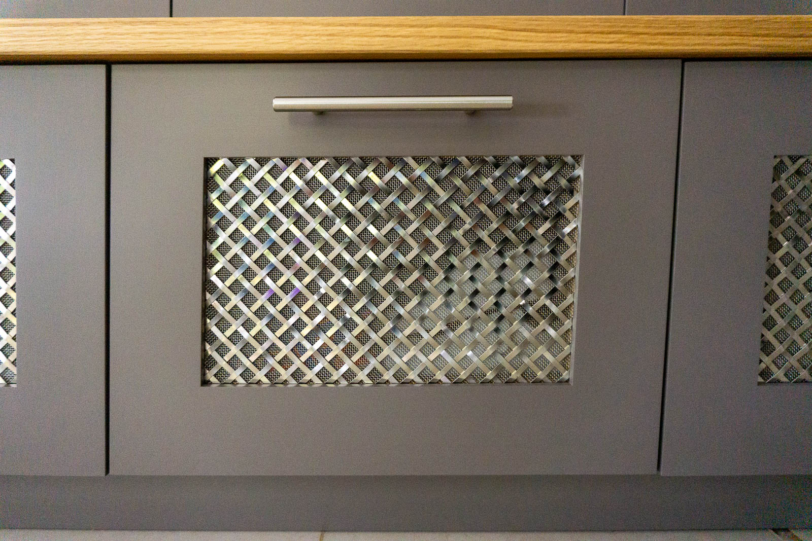 Shoe drawers with bespoke metal grilles in bespoke entranceway cabinet Bristol