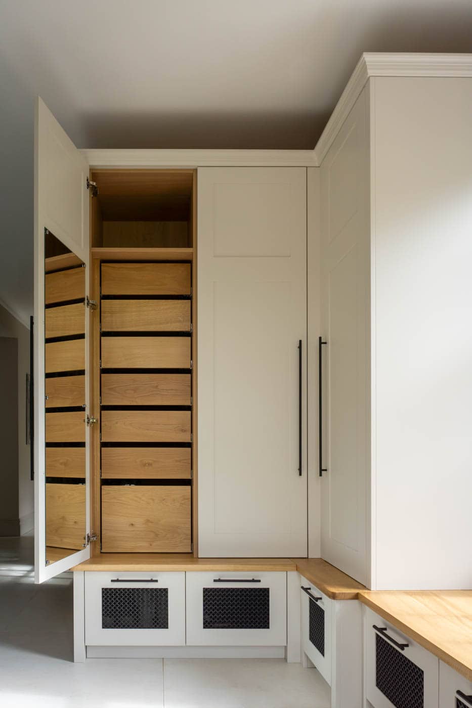 stak of oak drawers inside a bootroom cabinet