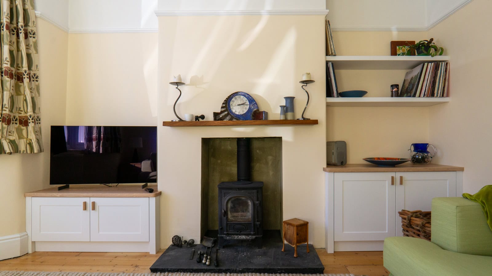 Bespoke alcove cabinets and shelves in a Bristol home, designed to complement the room's layout