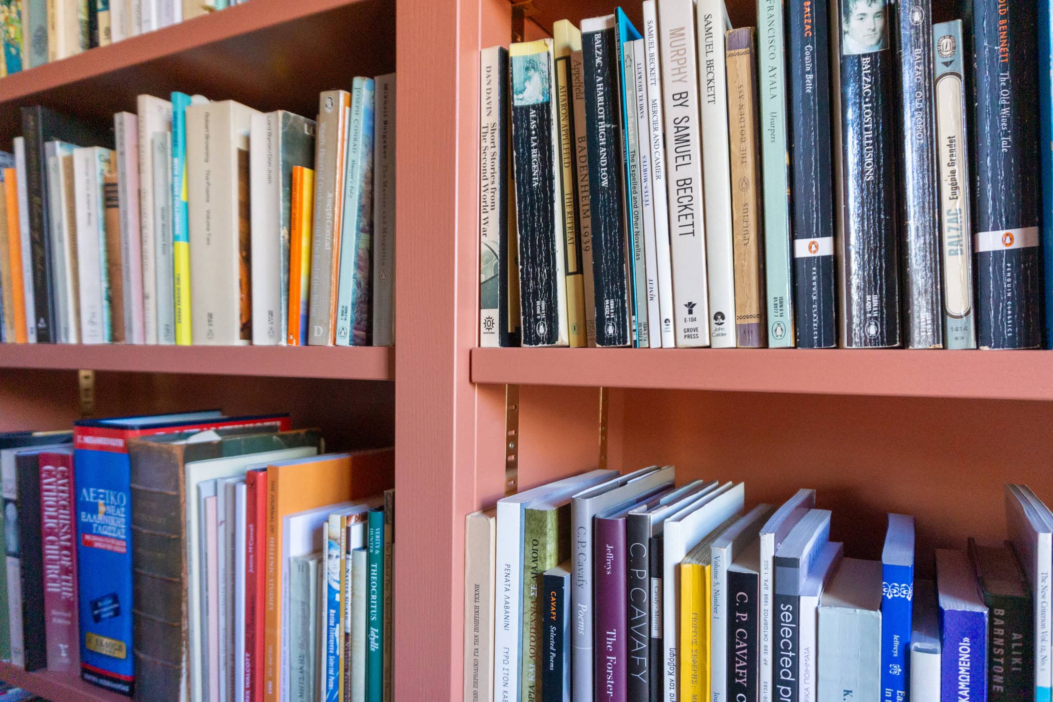 bookcase strips on a red earth bespoke bookroom