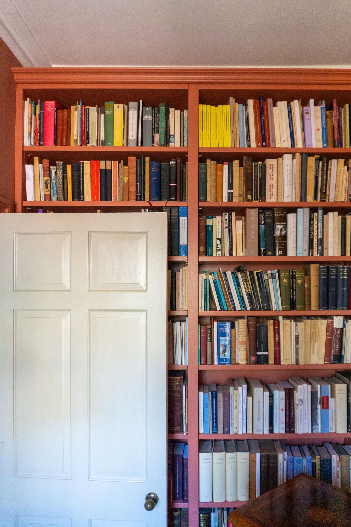 showing the door open onto the bookcase