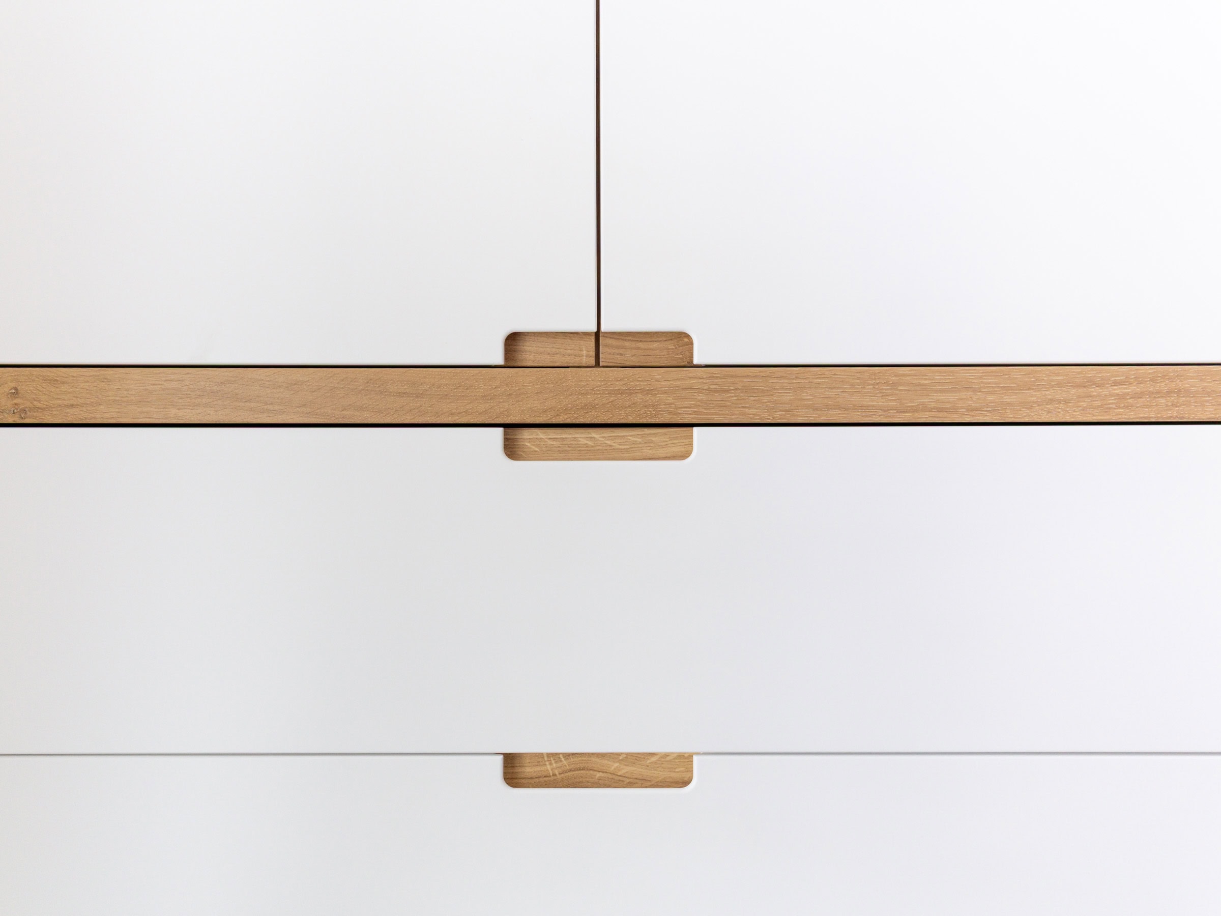 oak finger pull handle details on a modern built-in wardrobe Bristol