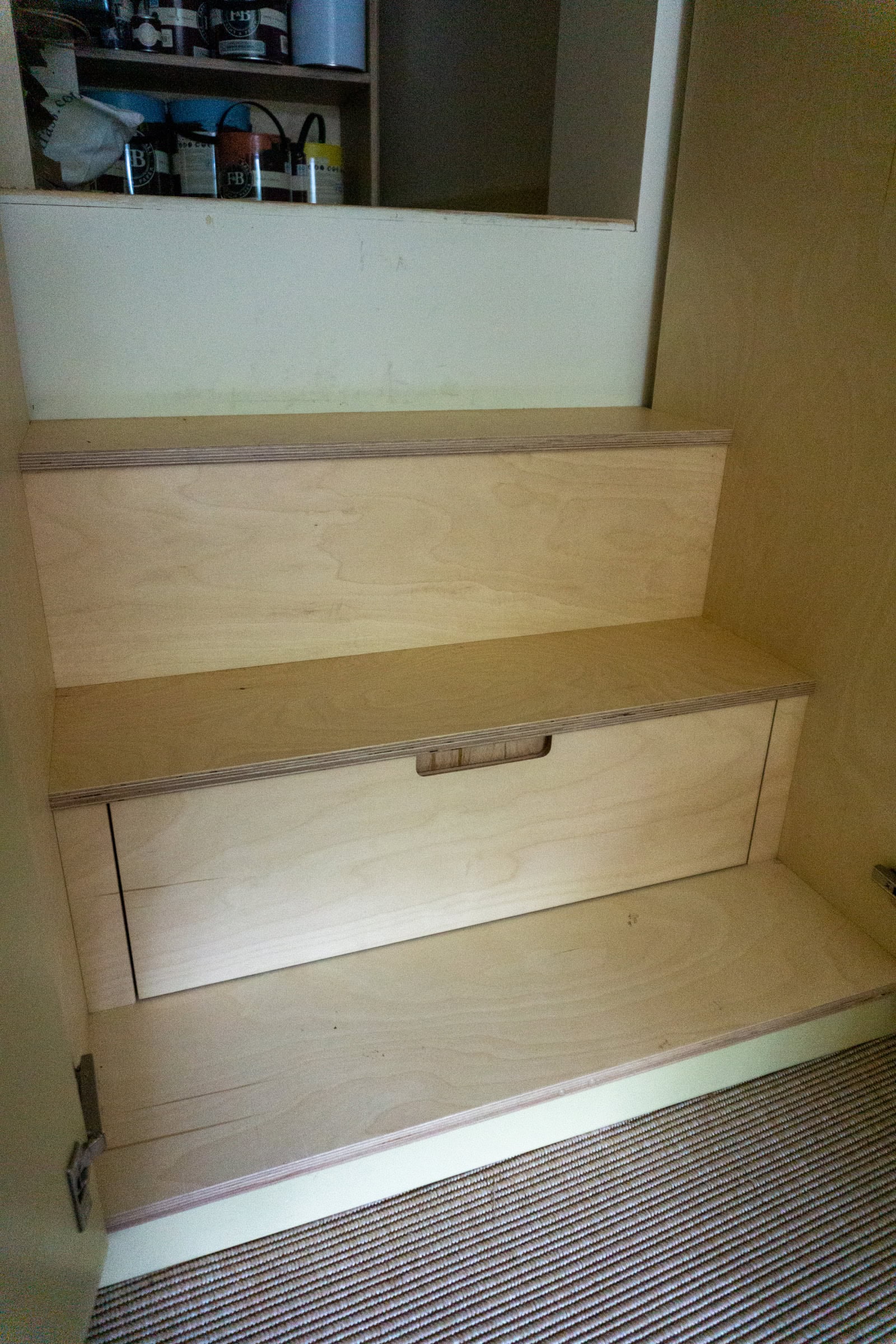 plywood step with a drawer inside