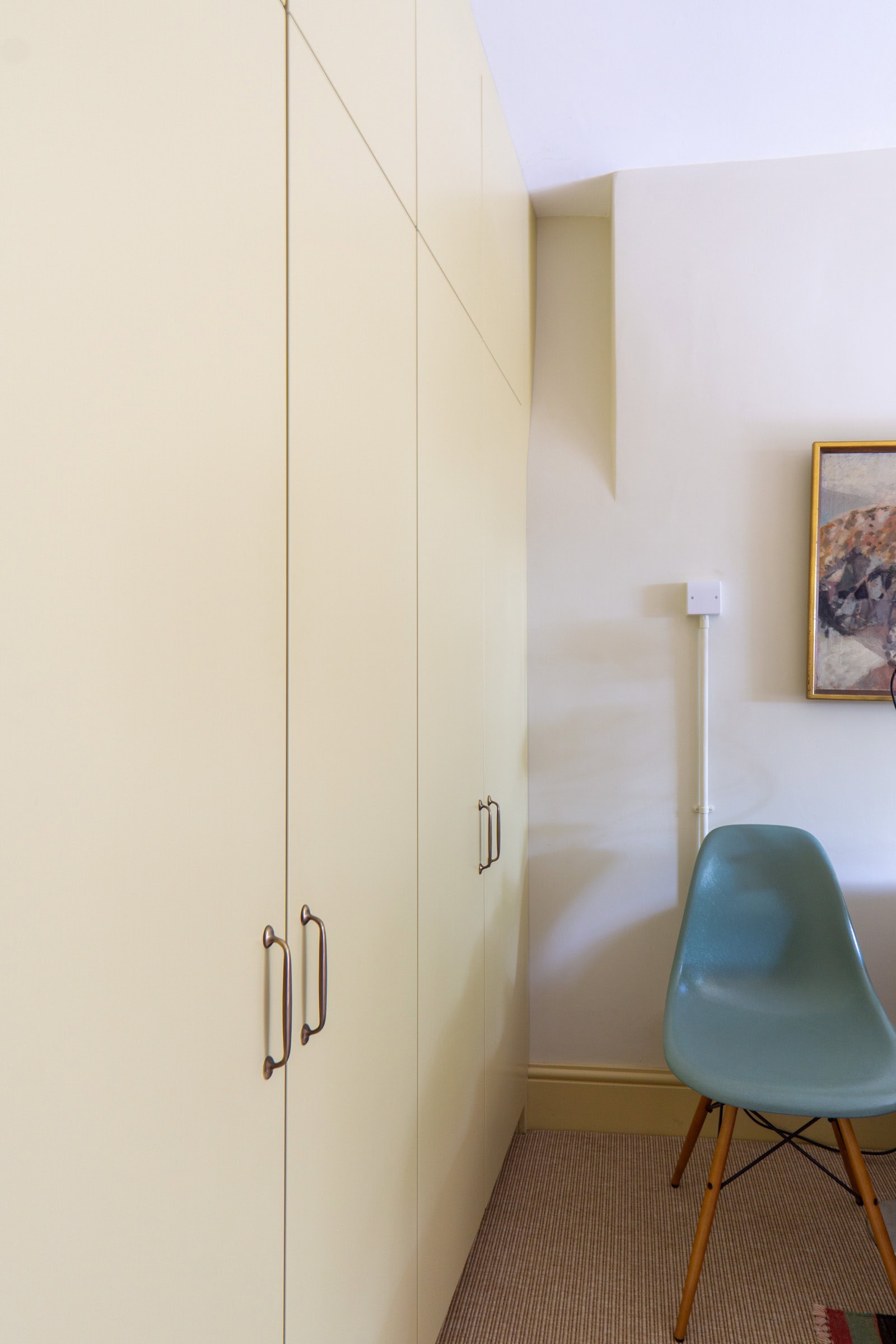 run of wardrobe doors and a curved scribing in