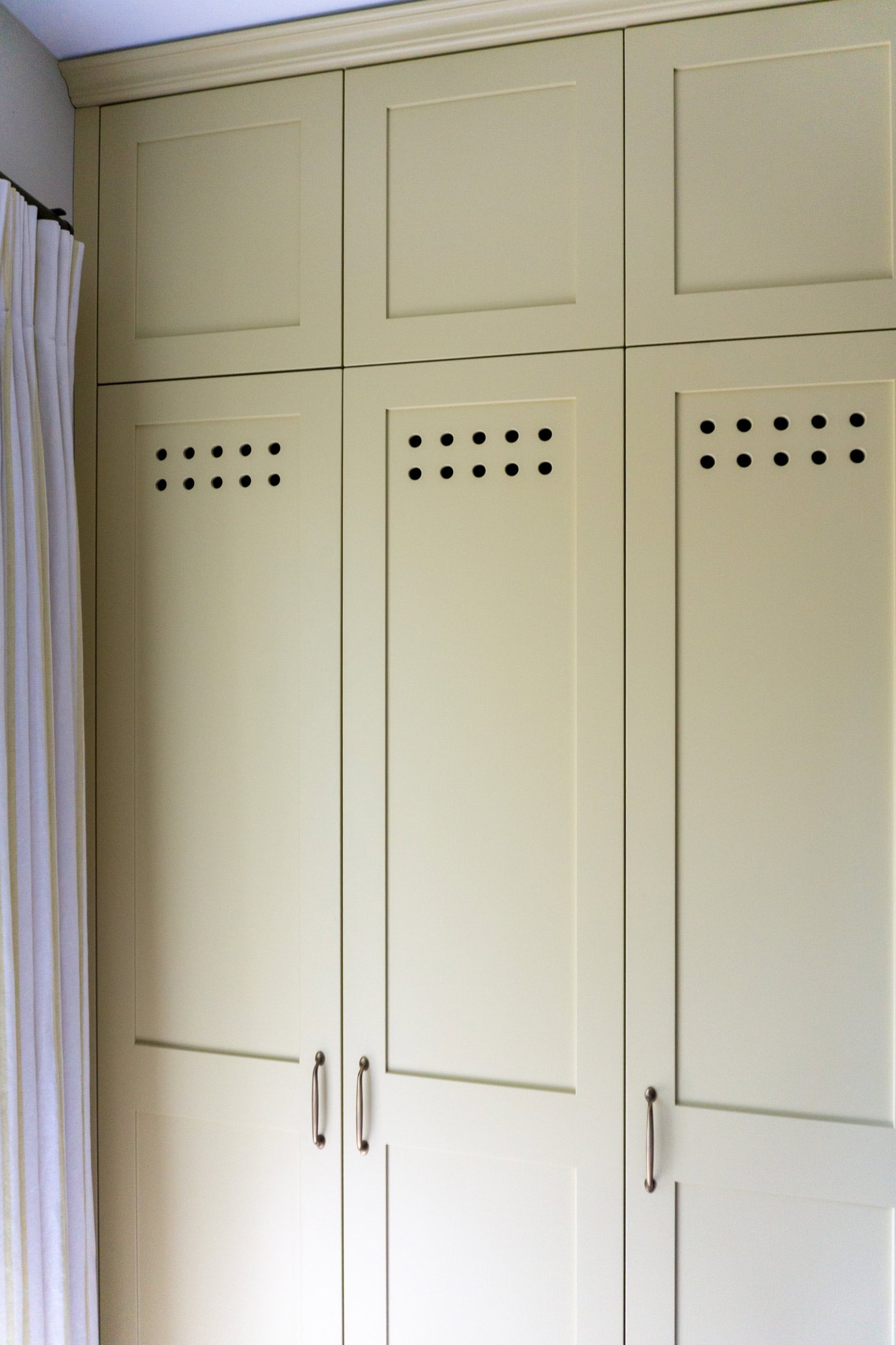 yellow fitted cabinets with vented holes