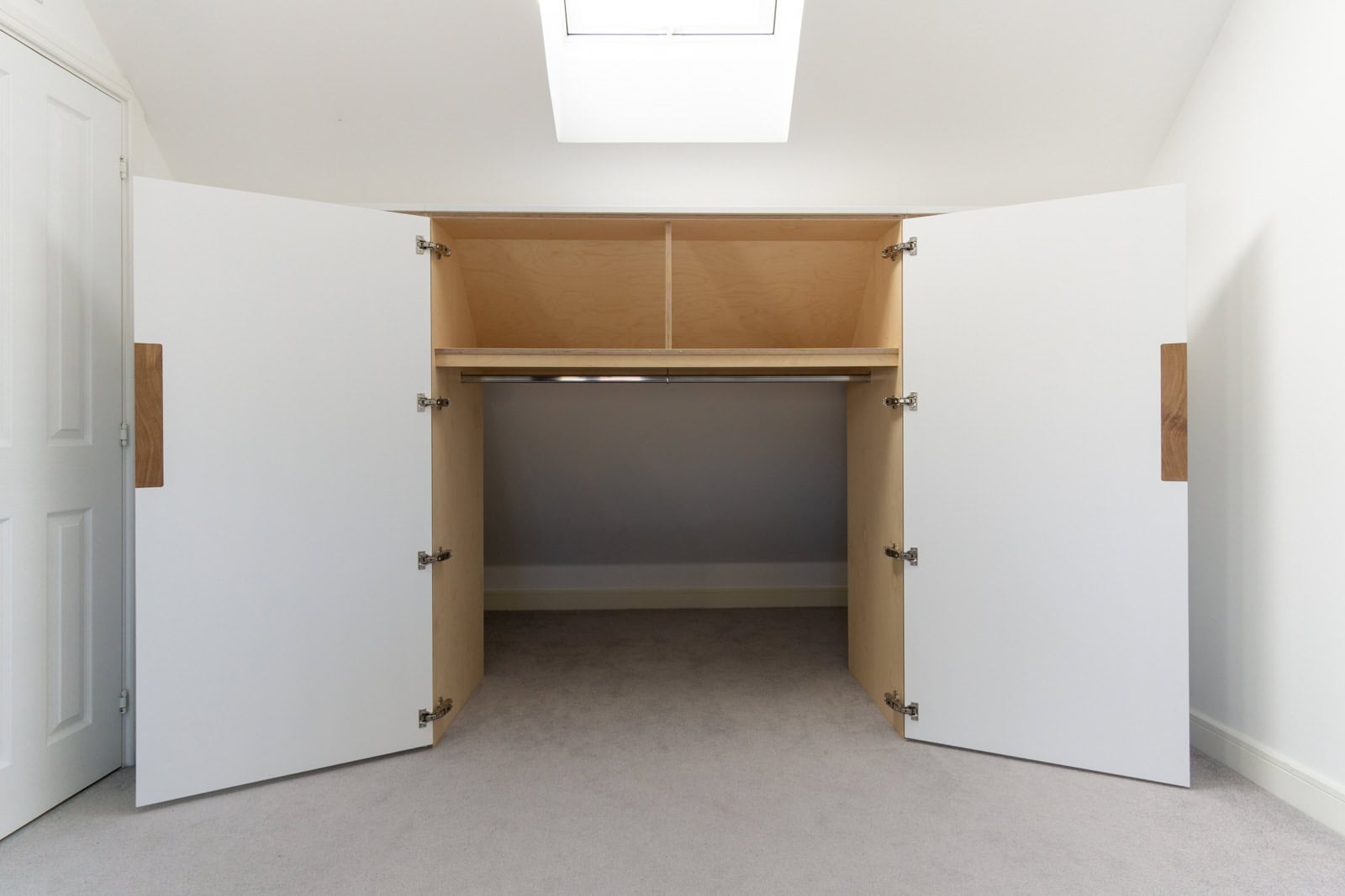 Birch plywood wardrobe interior with open cupboard storage