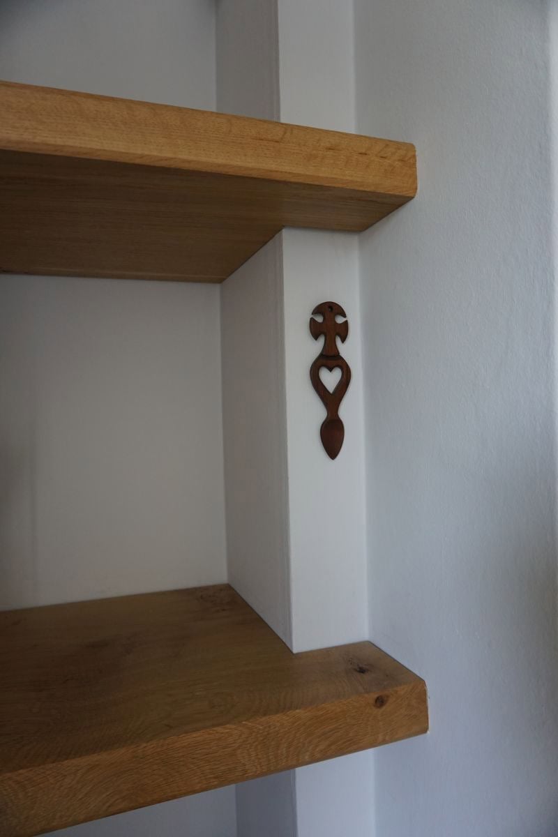 chunky solid oak floating shelves fitted in an alcove either side of a fireplace, bespoke made in Bristol